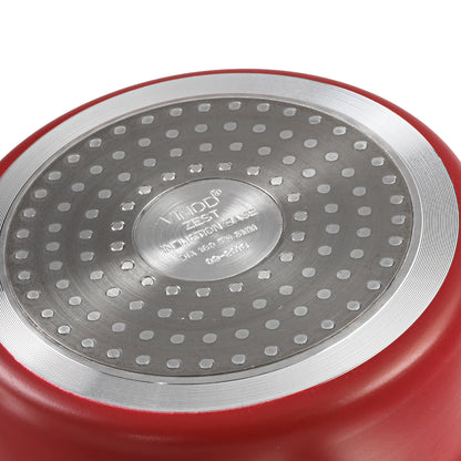 Close-up of a cookware base showing a durable induction-compatible bottom with a textured heat-distribution surface.