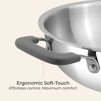 Stainless steel pot with ergonomic soft-touch handle on a light background