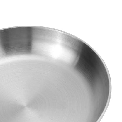 Close-up of a stainless steel bowl on a white background