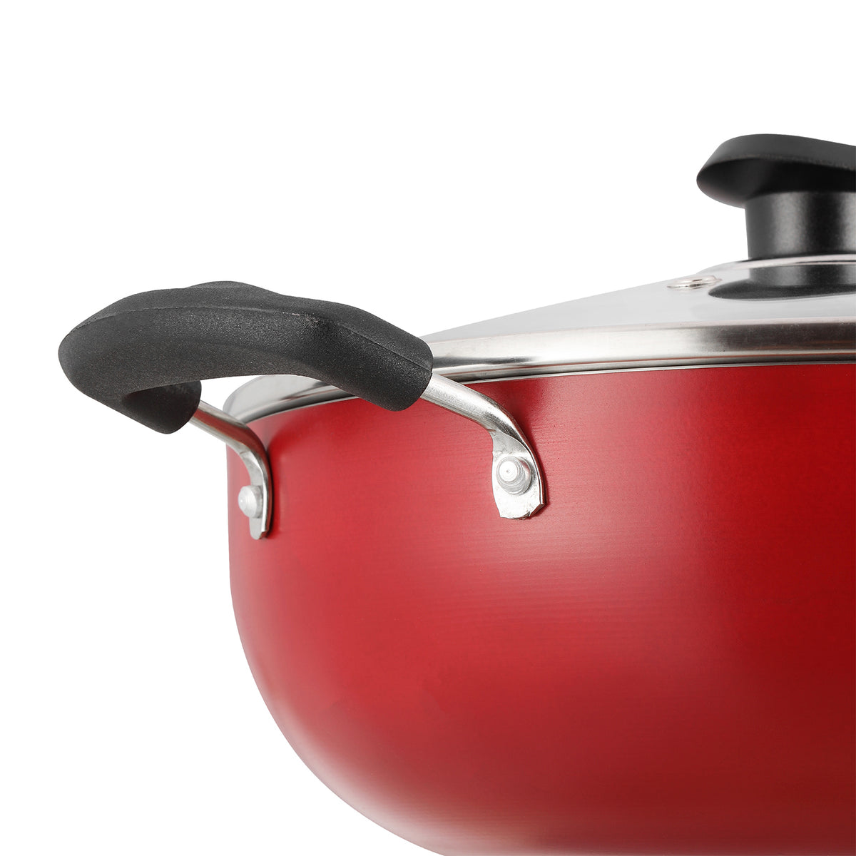 Close-up of a red nonstick kadai showing a sturdy side handle and glass lid with a secure metal fitting.
