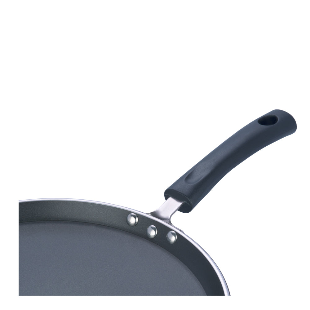 Close-up of a nonstick tawa showing a sturdy riveted handle with an ergonomic grip for comfortable use.