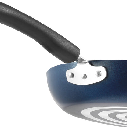 Close-up of a nonstick frying pan showing a sturdy riveted handle attachment and durable construction for everyday use.