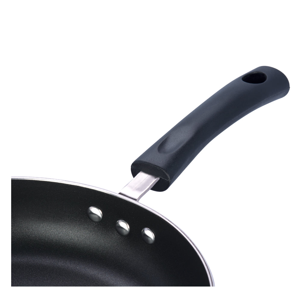 Close-up of a nonstick frying pan with a black ergonomic handle and secure riveted attachment for durability.