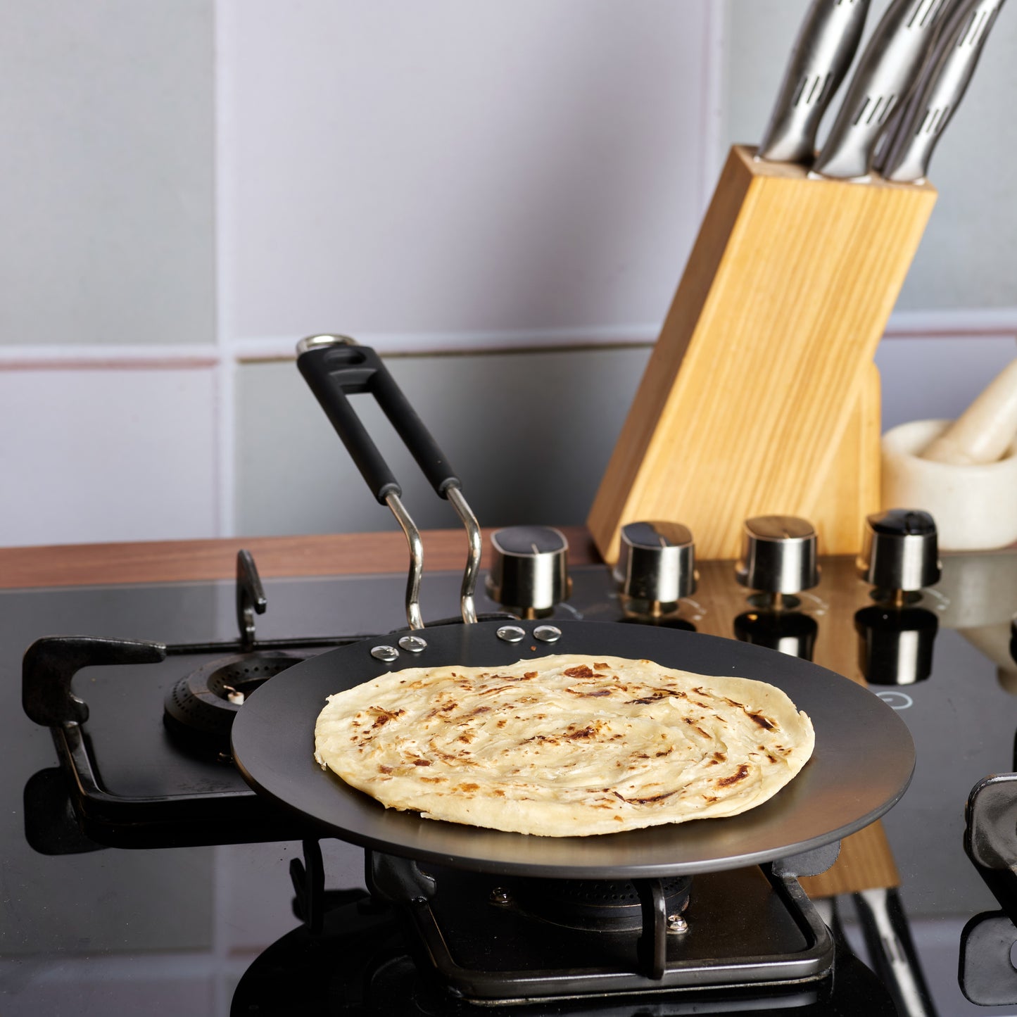 Vinod Hard Anodised Tawa - Lifestyle Cooking Shot | Vinod Cookware India